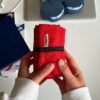 компактна сумка crossbody Morkwa червона складена у рулон