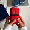 компактна сумка crossbody Morkwa червона складена у рулон
